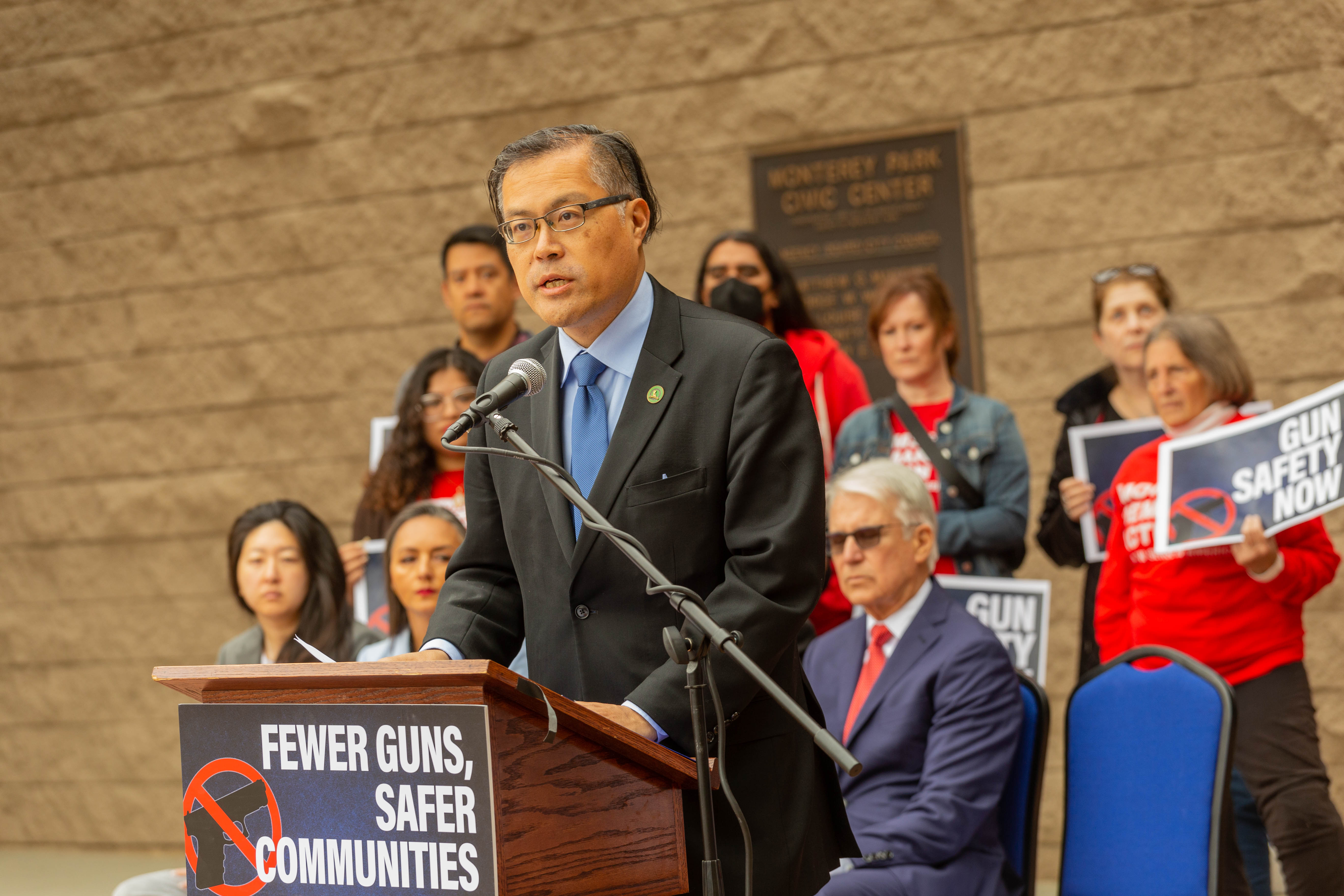 Assemblymember Mike Fong speaks at a podium to announce his gun safety measures.